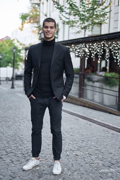 Handsome young male walking on the street