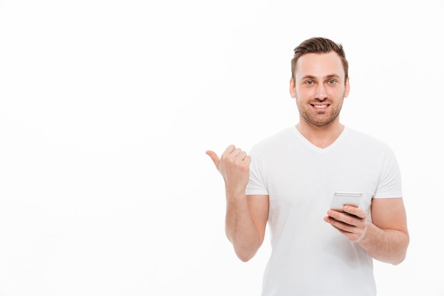 Handsome young man chatting by mobile phone