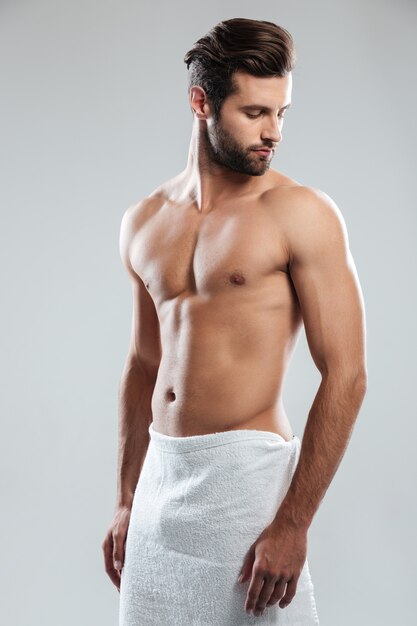 Handsome young man dressed in towel