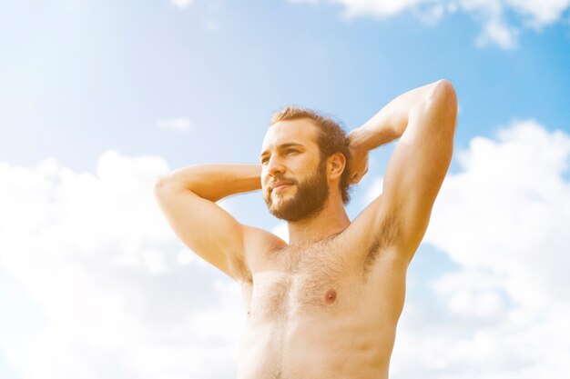 Handsome young man enjoying sun