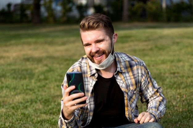 Handsome young man having a video call