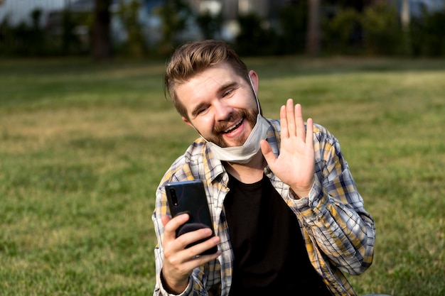 Handsome young man having a video call