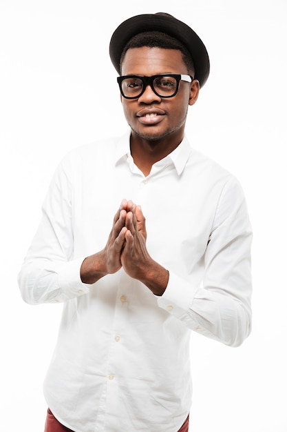 Handsome young man posing and praying