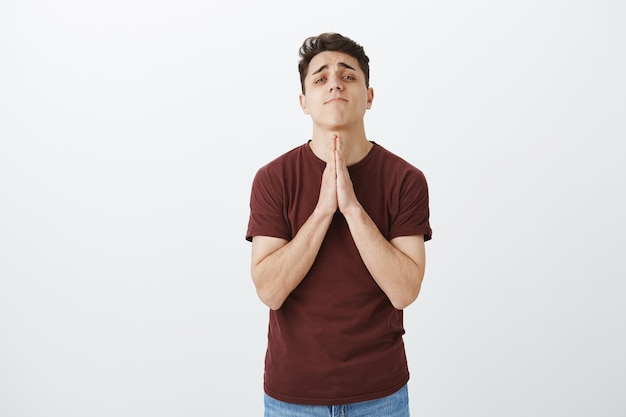 Free photo handsome young man praying