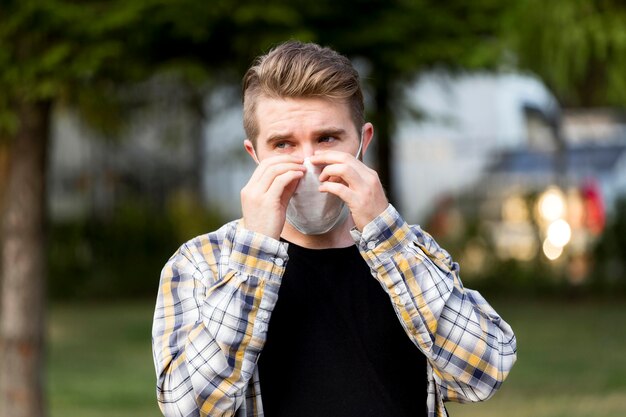 Handsome young man wearing face mask