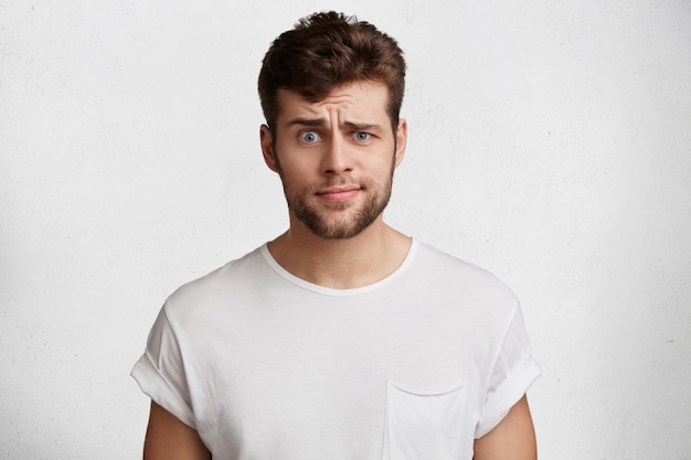 Handsome young man in white T-shirt