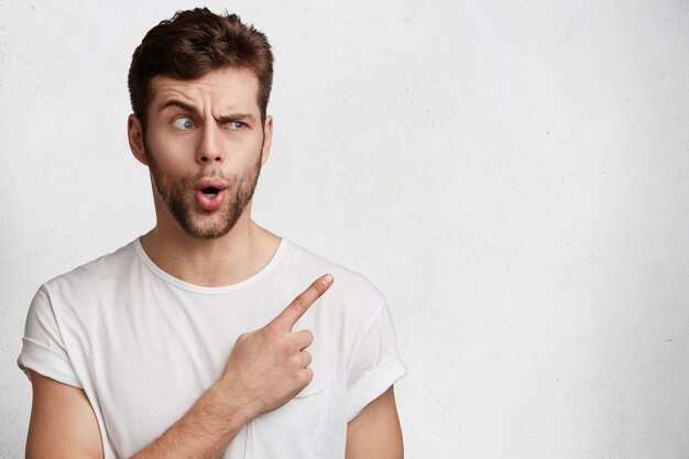 Handsome young man in white T-shirt