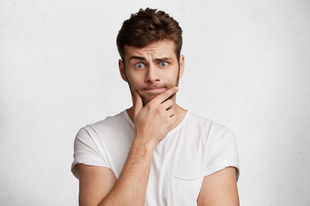 Handsome young man in white T-shirt