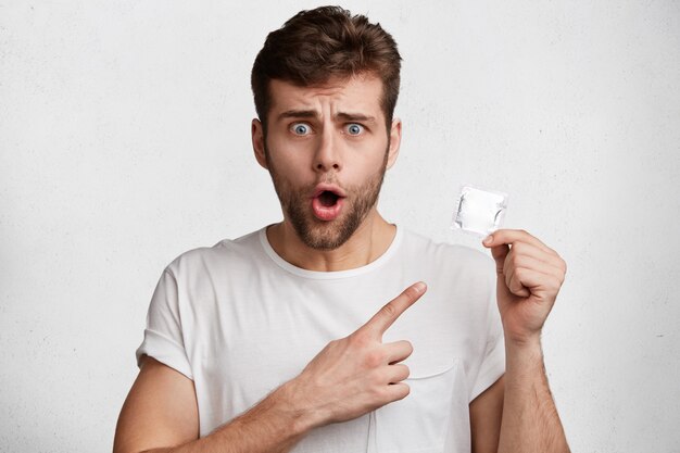 Handsome young man in white T-shirt