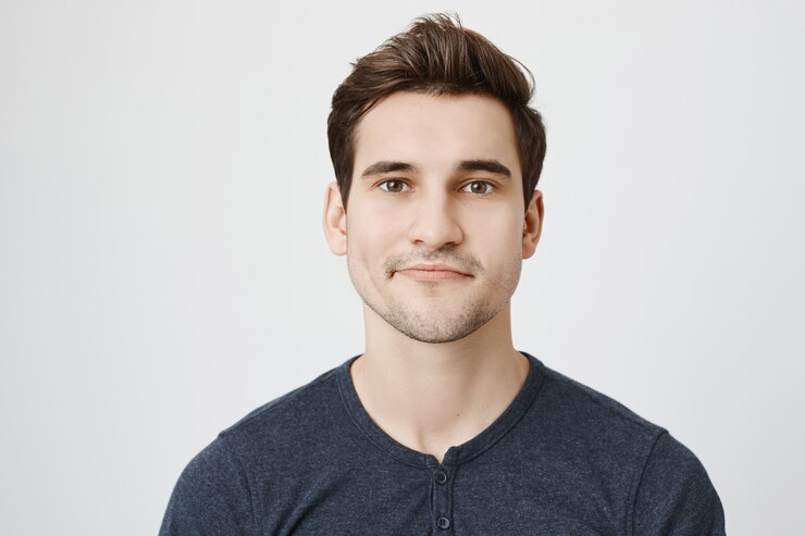 Free Photo handsome young man with new stylish haircut
