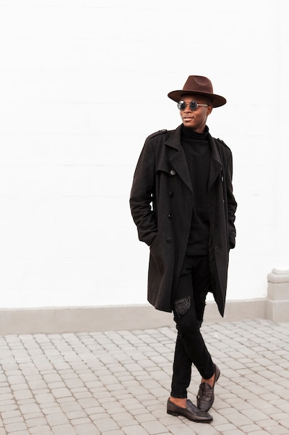 Handsome young man with sunglasses and hat