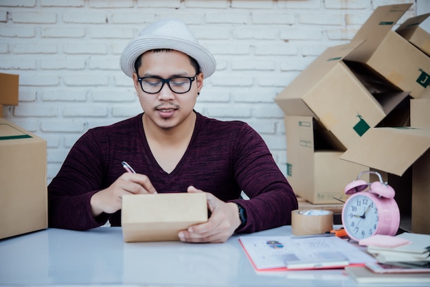 Free photo handsome young man working with papers