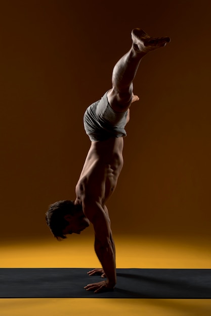 Handstand yoga pose on mat