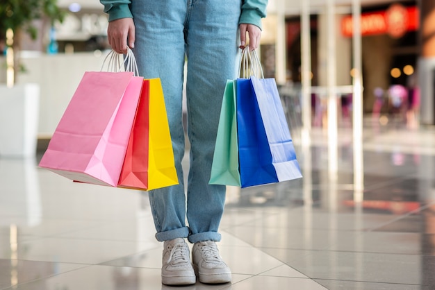 Hans holding colorful shopping bag