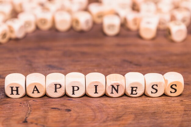 Happiness concept over wooden table