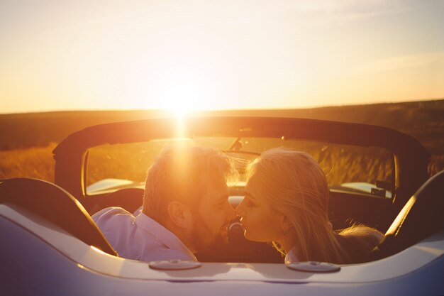 Happiness couple stay in the new sport car