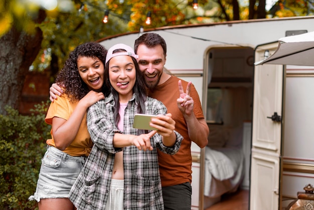 Happy adventurous friends taking a selfie