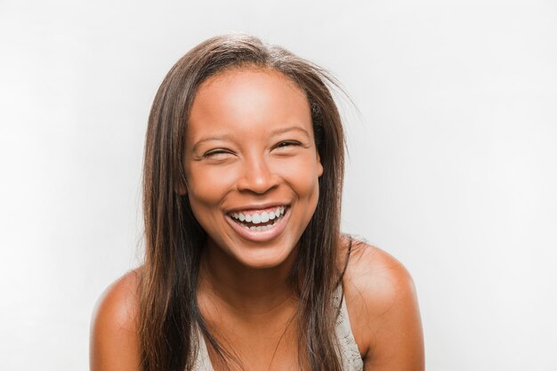 Happy african teenage girl on white background