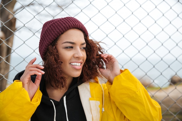 Free photo happy african young lady walking outdoors