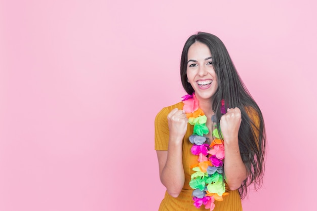 Happy amazed woman on pink background