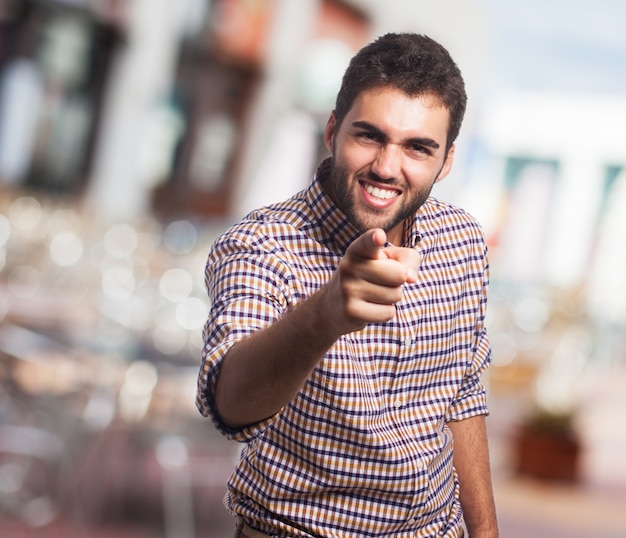 Free photo happy arabic man pointing to the camera