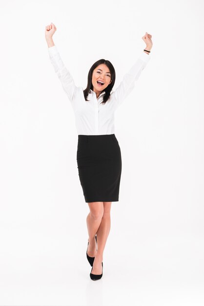 a happy asian businesswoman standing