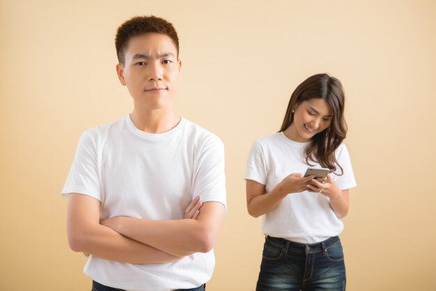 Happy Asian couple in studio