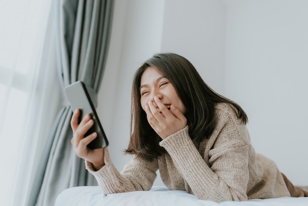 Premium Photo | Happy asian woman enjoy using smartphone