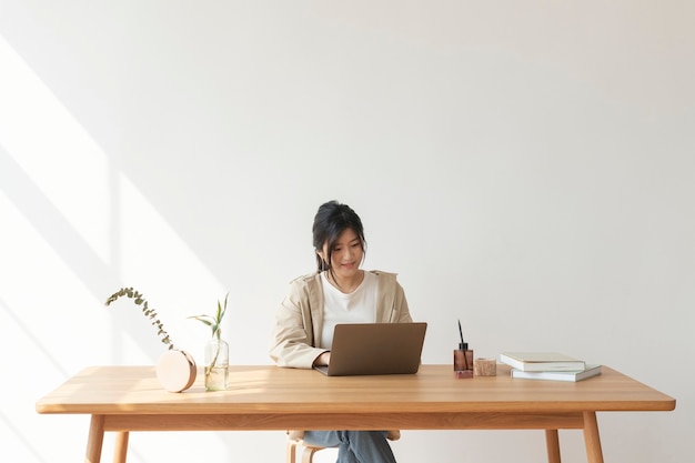 Happy Asian woman working from home