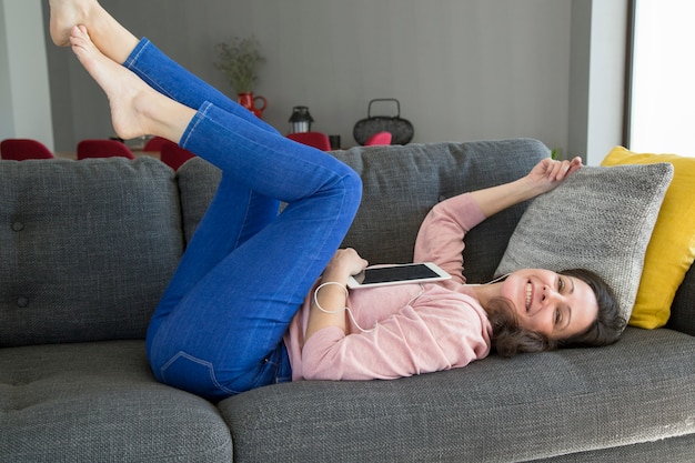 Free Photo happy attractive young woman listening to music