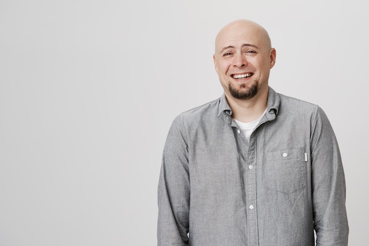 Free Photo happy bald adult man laughing