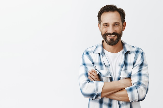 Happy bearded mature man posing