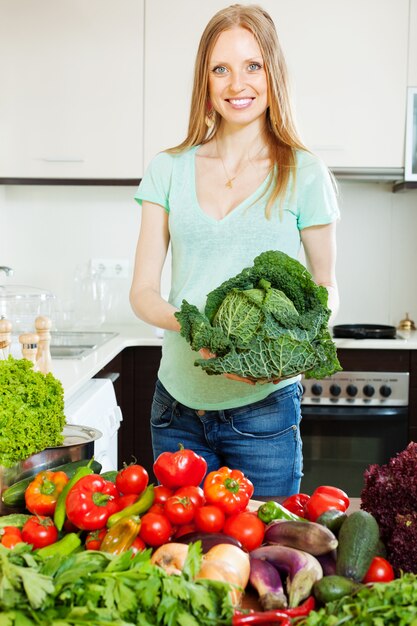 happy beautiful woman with raw vegetables