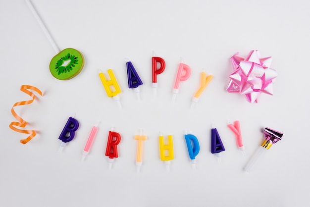 Happy birthday candles with colorful objects