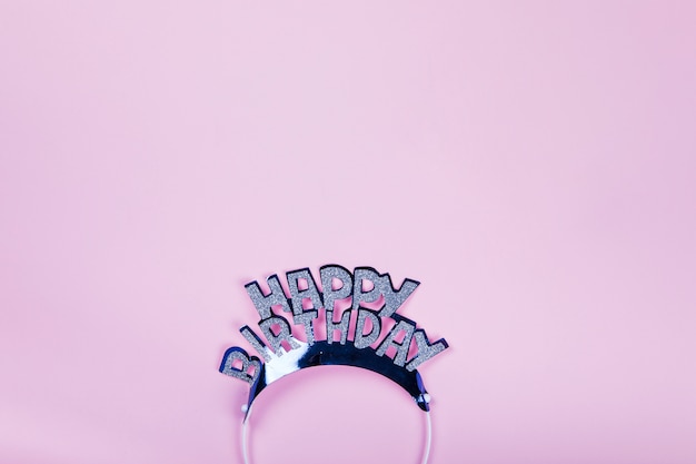 Happy birthday crown on pink background
