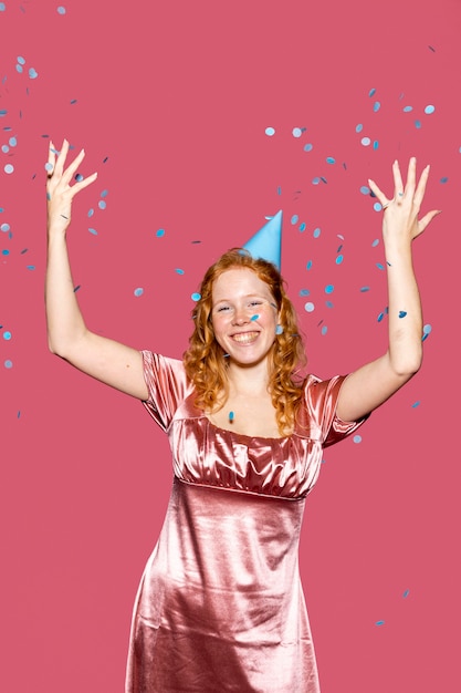 Free photo happy birthday girl throwing confetti