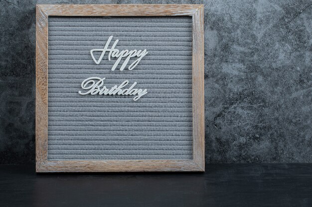 Happy birthday phrase embedded on the grey tissue