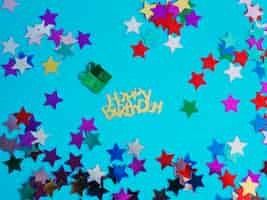 Free photo happy birthday and star confetti