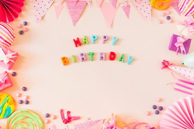 Happy birthday text with party concept on colored background