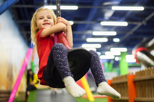 Free photo happy blonde girl playing indoors