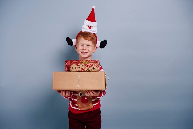 Happy boy holding gift box