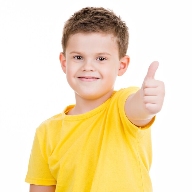Happy boy showing thumbs up gesture.Isoated on white