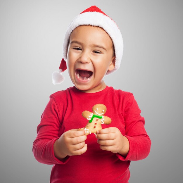 Happy boy with his gingerbread