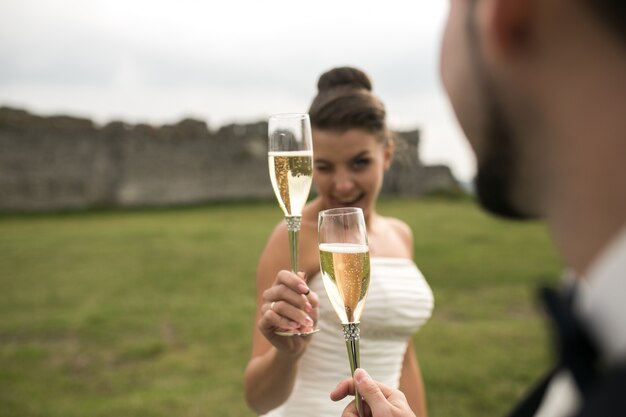 Happy bride toasting with her husband