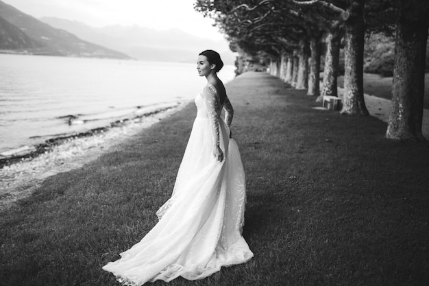 Happy bride woman in a wedding dress posing