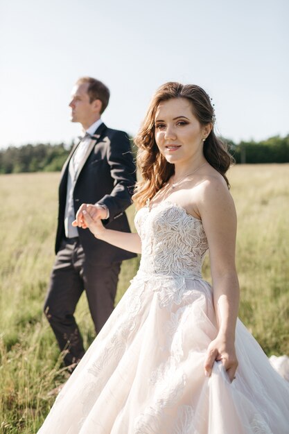 Happy brides hold each other by the hand