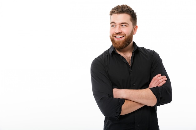 Happy business man in shirt with crossed arms looking away