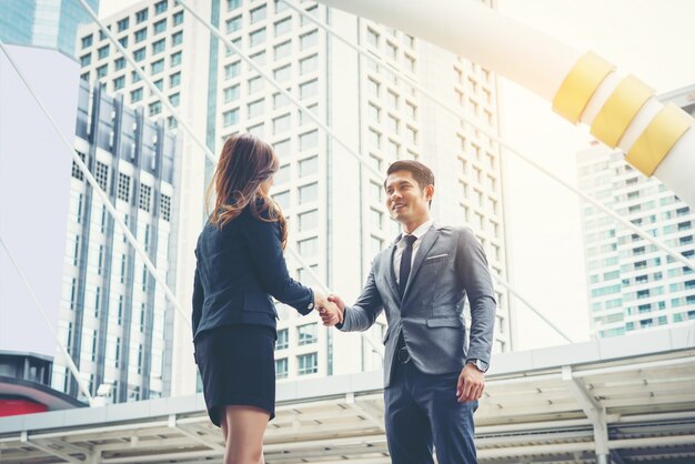 Happy business people shaking hands. Business success.