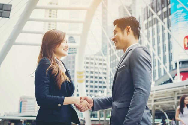 Happy business people shaking hands. Business success.