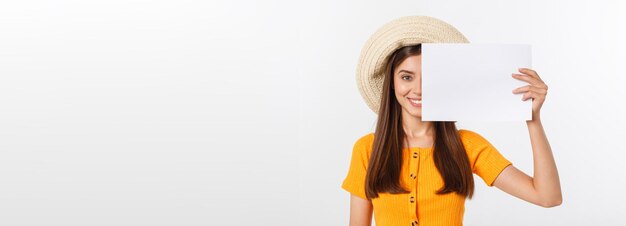 Happy business woman holding big white sign board gray wall back